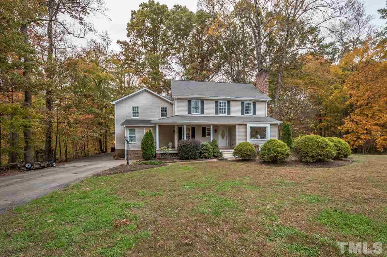 12217 Norwood Road Raleigh, NC 27613 - Photo 27 of 27 a front view of a house with a garden