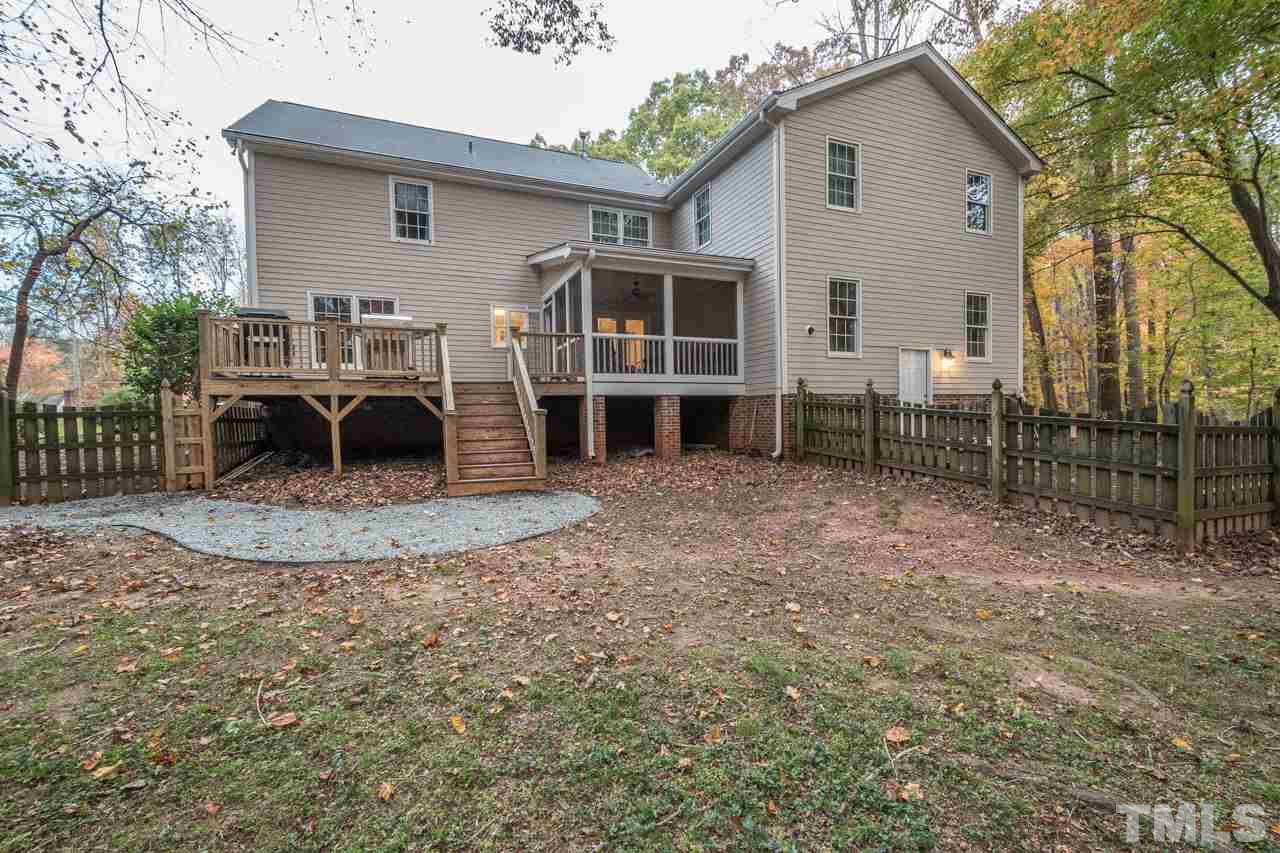 12217 Norwood Road Raleigh, NC 27613 - Photo 4 of 27 a view of a house with backyard