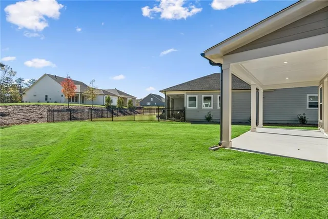 a view of an house with backyard porch and garden