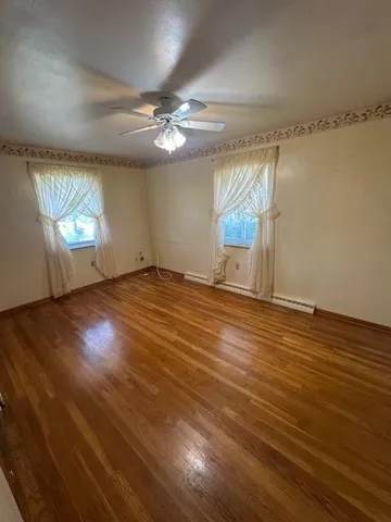 a view of a room with mini refrigerator and a flat screen tv