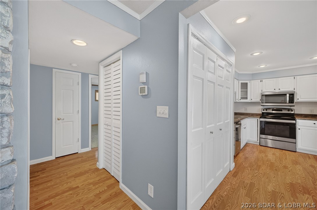 1111 Passover Road, Unit N1 Osage Beach, MO 65065 - Photo 39 of 57 Hallway to both bedrooms and baths.