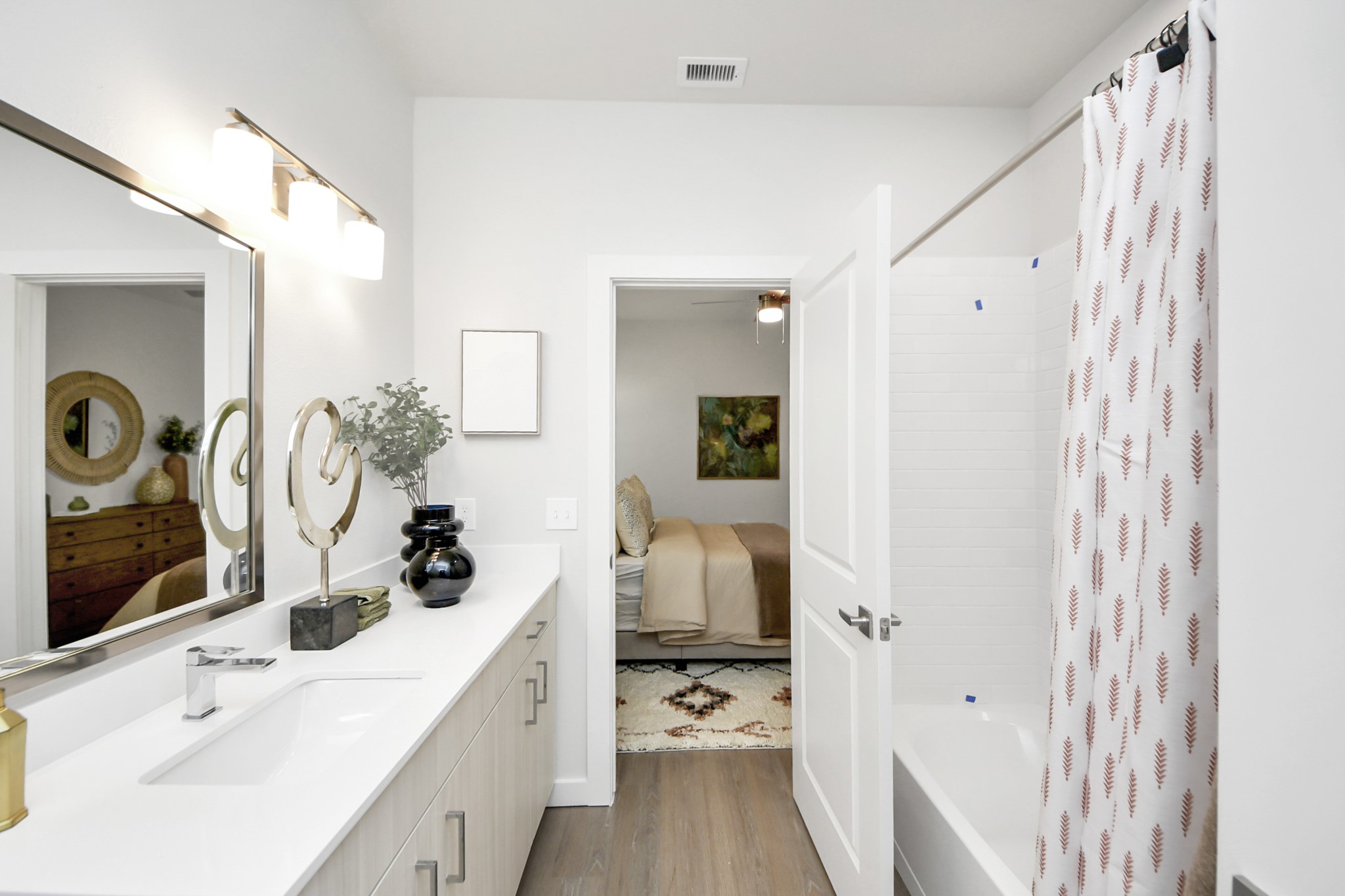 7306 Corey Rushing Lane Richmond, TX 77407 - Photo 19 of 50 a bathroom with a sink and mirror with shower