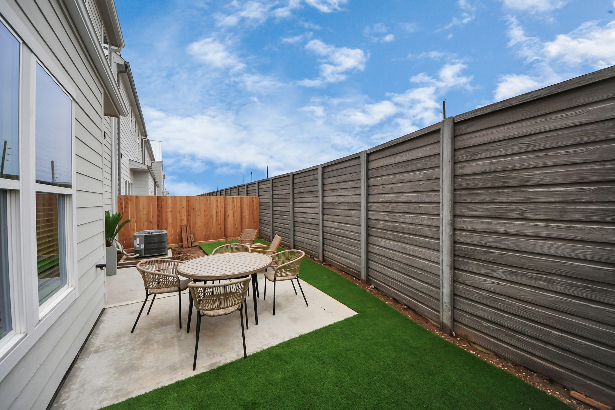 7306 Corey Rushing Lane Richmond, TX 77407 - Photo 32 of 50 a view of a chair and table in backyard of the house