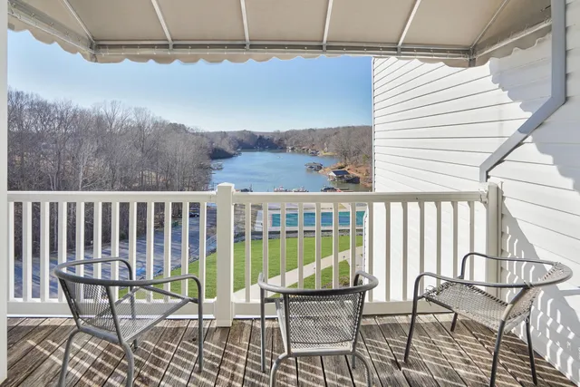 a view of a chair and table in the balcony