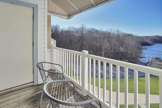a view of a balcony with chairs