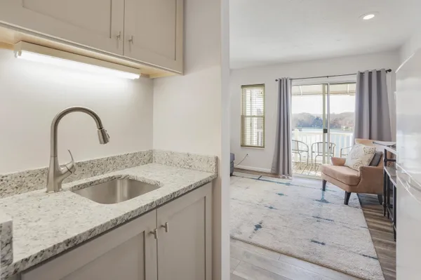 a white refrigerator freezer sitting inside of a kitchen