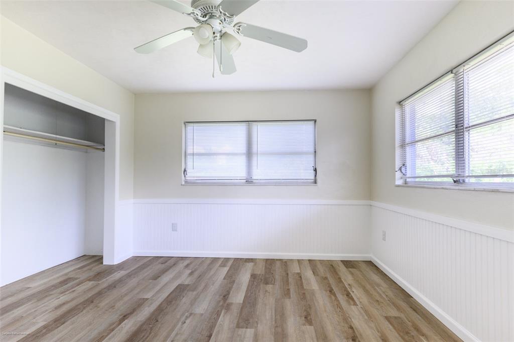 1214 Ansin Street Punta Gorda, FL 33950 - Photo 15 of 24 an empty room with windows and fan