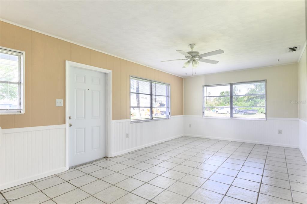 1214 Ansin Street Punta Gorda, FL 33950 - Photo 8 of 24 a view of an empty room with a window