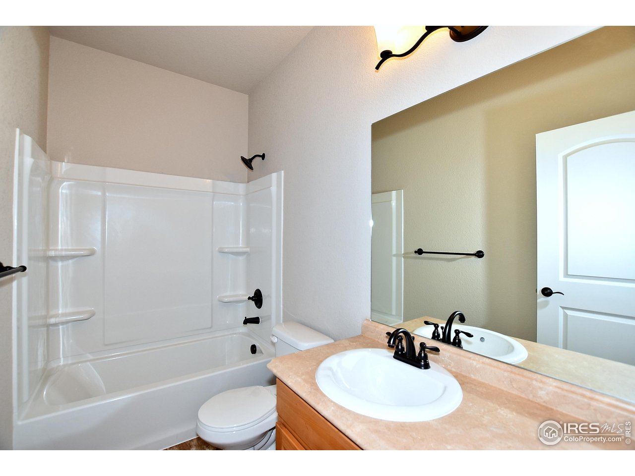 623 86th Avenue Greeley, CO 80634 - Photo 32 of 38 a bathroom with a sink toilet bathtub and shower