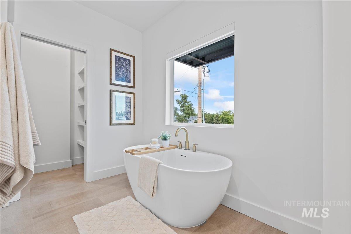 1011 South Orchard Street, Unit 101 Boise, ID 83705 - Photo 10 of 16 Full bath featuring a freestanding tub and baseboards