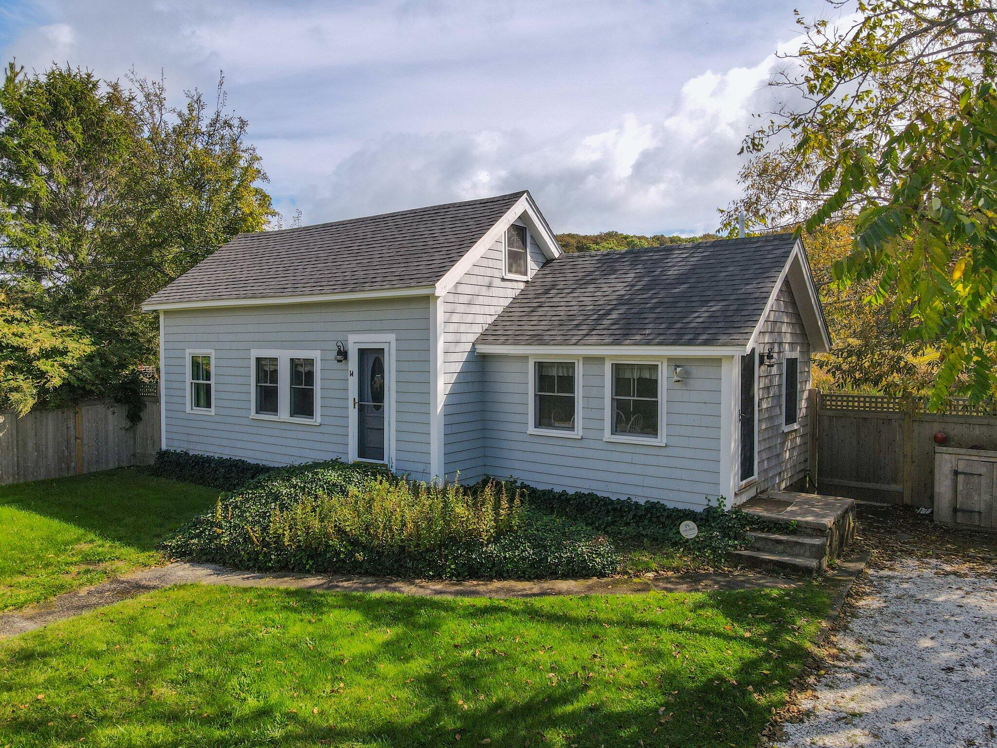14 Pond Road Truro, MA 02666 - Photo 3 of 49 a view of a house with a yard and a large tree