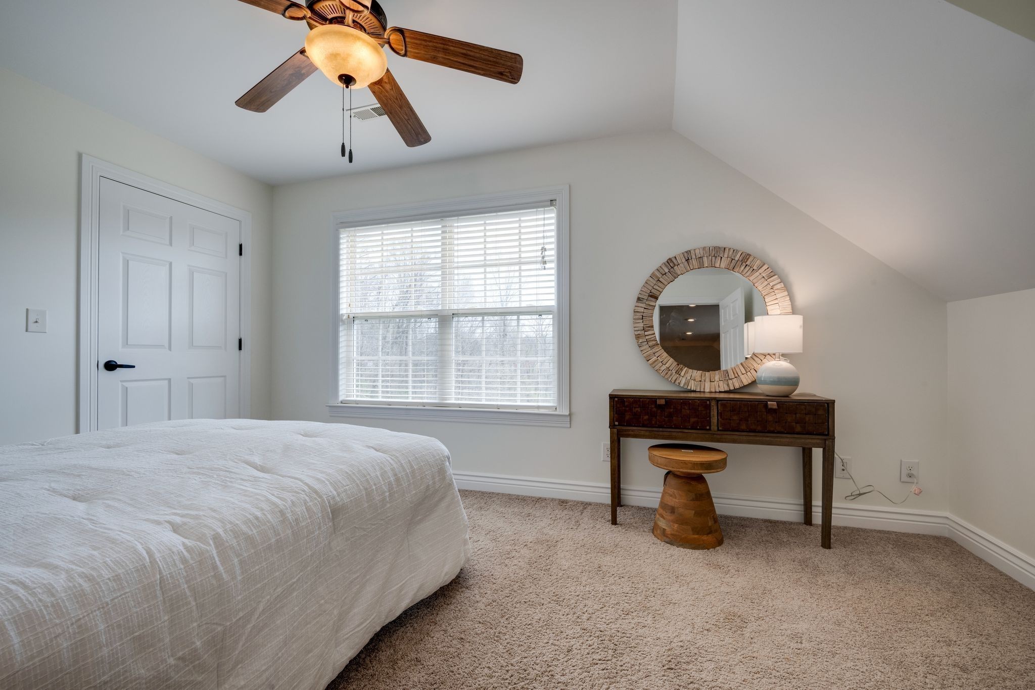 264 Fire Tower Road Dickson, TN 37055 - Photo 26 of 46 a bedroom with a bed a chair and chandelier