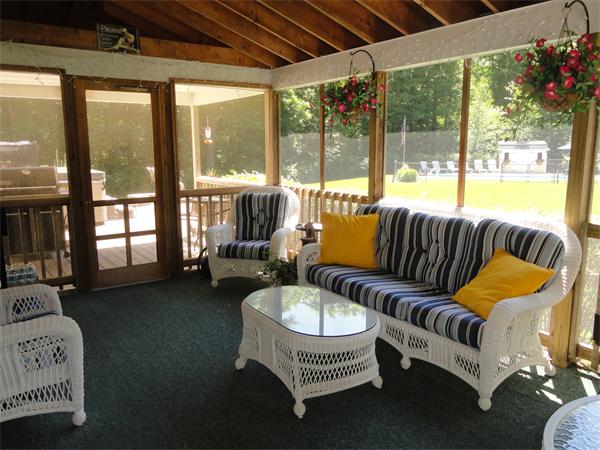 98 Bushy Lane Rutland, MA 01543 - Photo 12 of 30 a living room with furniture and a floor to ceiling window