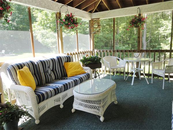 98 Bushy Lane Rutland, MA 01543 - Photo 13 of 30 a outdoor living room with furniture and a floor to ceiling window