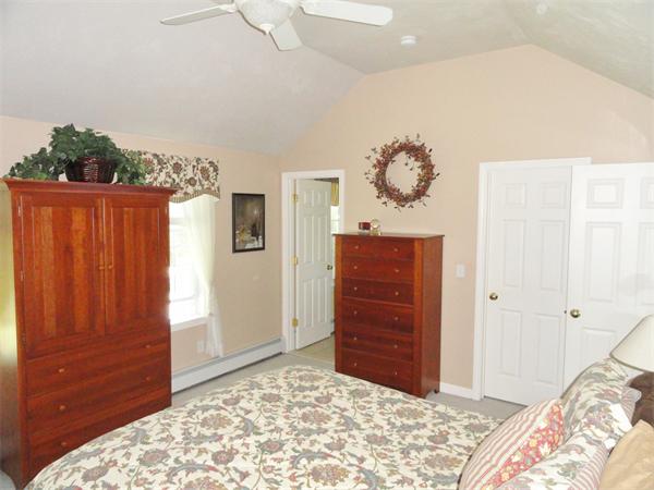 98 Bushy Lane Rutland, MA 01543 - Photo 15 of 30 a bedroom with a bed and a dresser
