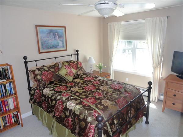 98 Bushy Lane Rutland, MA 01543 - Photo 17 of 30 a bed sitting in a bedroom next to a window