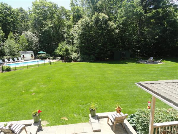 98 Bushy Lane Rutland, MA 01543 - Photo 25 of 30 a view of a couple of people sitting in a yard