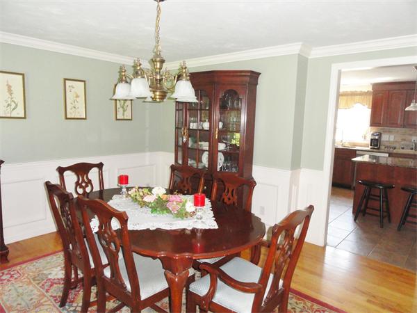 98 Bushy Lane Rutland, MA 01543 - Photo 9 of 30 a view of a dining room with furniture window and wooden floor
