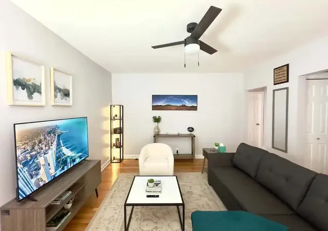 a living room with furniture and rug