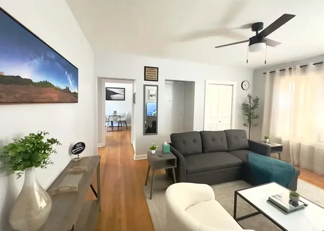 a living room with furniture and a window