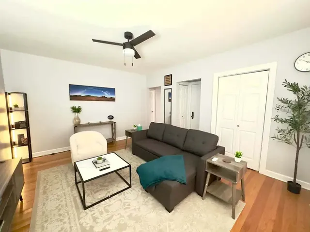 a living room with furniture and a window