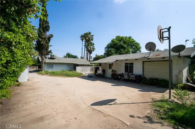 a view of house with outdoor space and sitting area