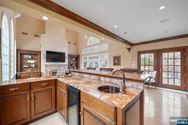 a kitchen that has a sink and a stove in it