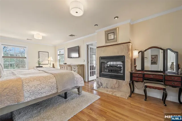 a bed room with a bed and a fireplace