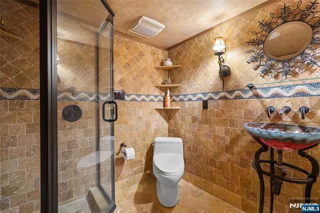 a bathroom with a toilet and a sink