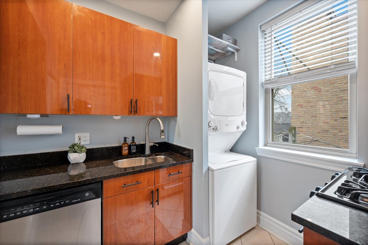 3135 West Palmer Square, Unit 3 Chicago, IL 60647 - Photo 11 of 30 a kitchen with a sink a stove and cabinets