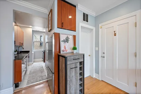 a kitchen with stainless steel appliances granite countertop a refrigerator and a sink