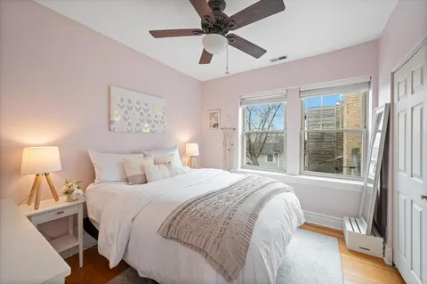 a bedroom with a large bed and a window