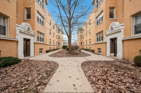 a view of a house with a snow on the road