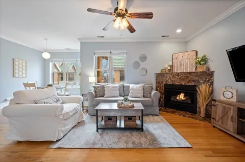 a living room with furniture and a fireplace