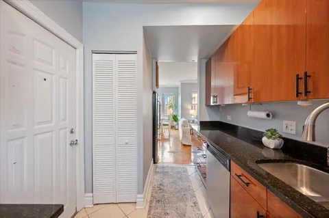 a kitchen with a sink and a refrigerator