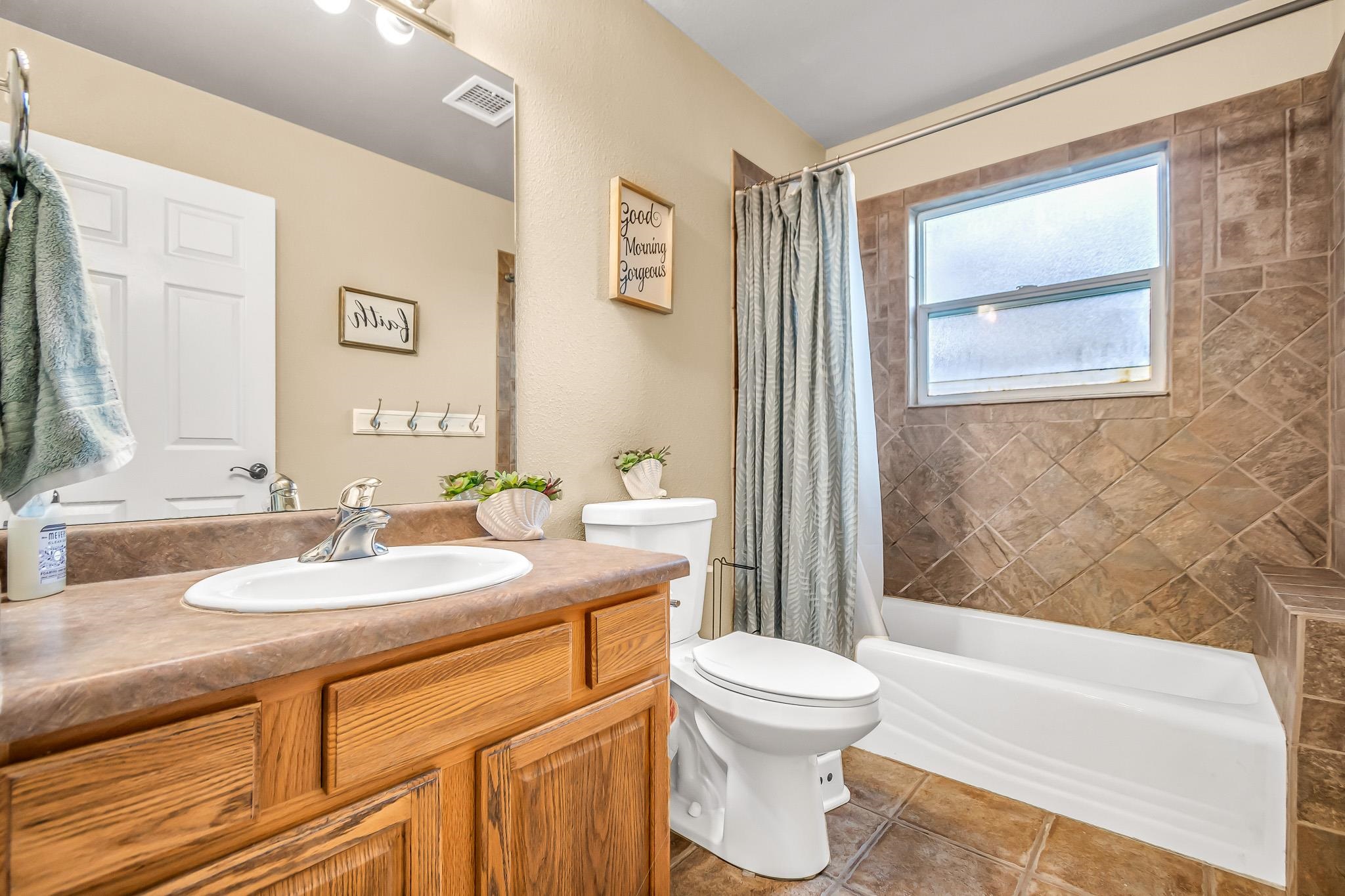 697 Jasper Drive Fruita, CO 81521 - Photo 19 of 26 a bathroom with a sink and a mirror
