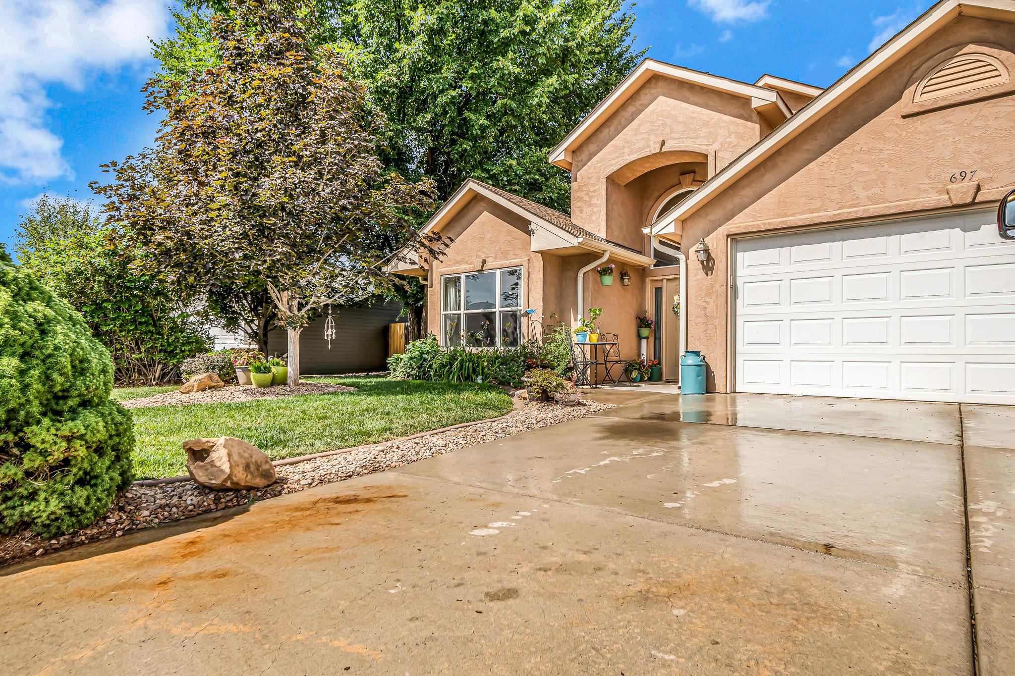 697 Jasper Drive Fruita, CO 81521 - Photo 25 of 26 a view of a house with a yard and large tree