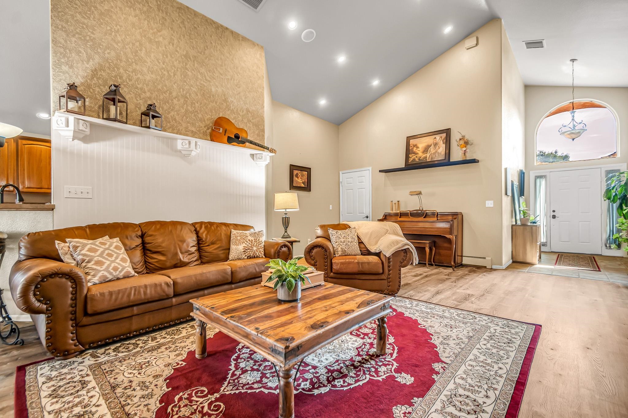 697 Jasper Drive Fruita, CO 81521 - Photo 3 of 26 a living room with furniture a rug and a table