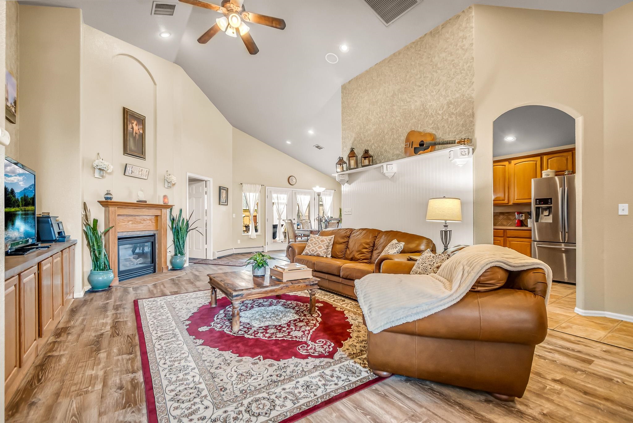 697 Jasper Drive Fruita, CO 81521 - Photo 4 of 26 a living room with furniture fireplace and a table