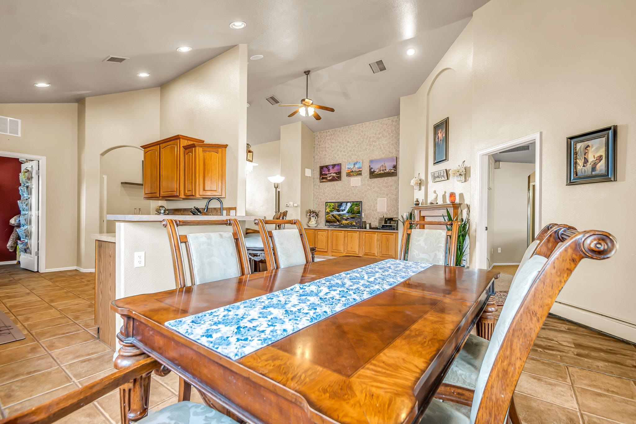 697 Jasper Drive Fruita, CO 81521 - Photo 10 of 26 a kitchen with stainless steel appliances kitchen island granite countertop a stove and white cabinets