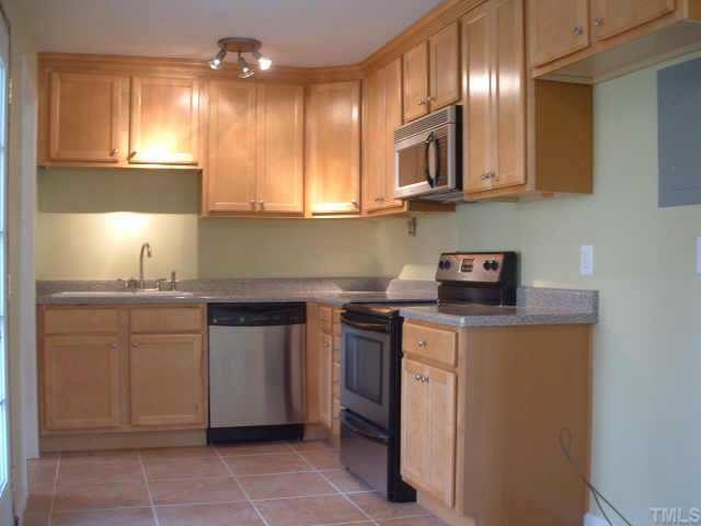 2319 Stevens Road Raleigh, NC 27610 - Photo 2 of 7 a kitchen with cabinets and window