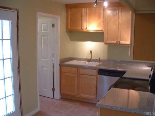 2319 Stevens Road Raleigh, NC 27610 - Photo 3 of 7 a kitchen with a sink cabinets and a window