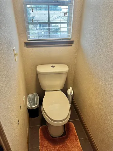 a bathroom with a toilet and a sink