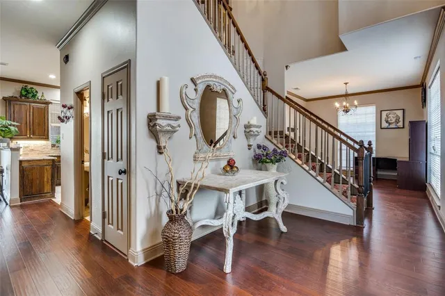 a view of an entryway with wooden floor and windows