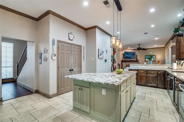 a kitchen with kitchen island granite countertop lots of counter top space