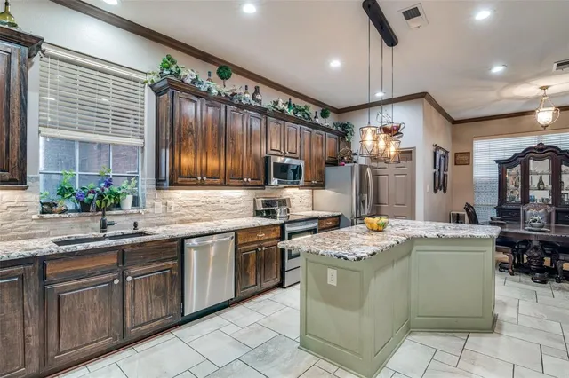 a kitchen with a sink stove and cabinets