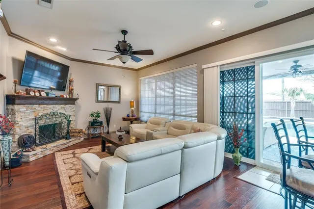 a living room with furniture fireplace and a flat screen tv