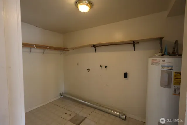 a view of a storage & utility room with closet
