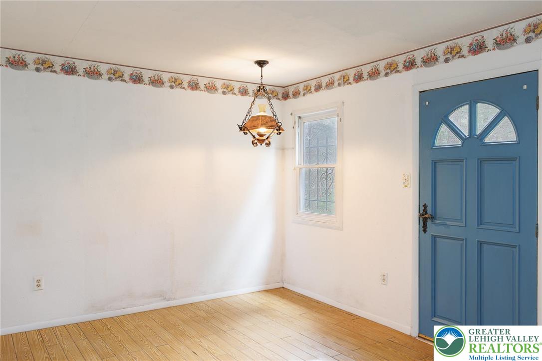 5211 Fir Lane Pocono Summit, PA 18346 - Photo 14 of 38 a view of a room with wooden floor and windows
