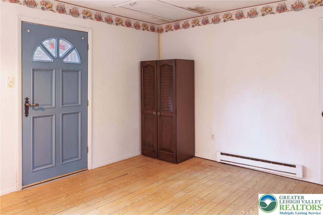 5211 Fir Lane Pocono Summit, PA 18346 - Photo 16 of 38 a view of empty room with wooden floor
